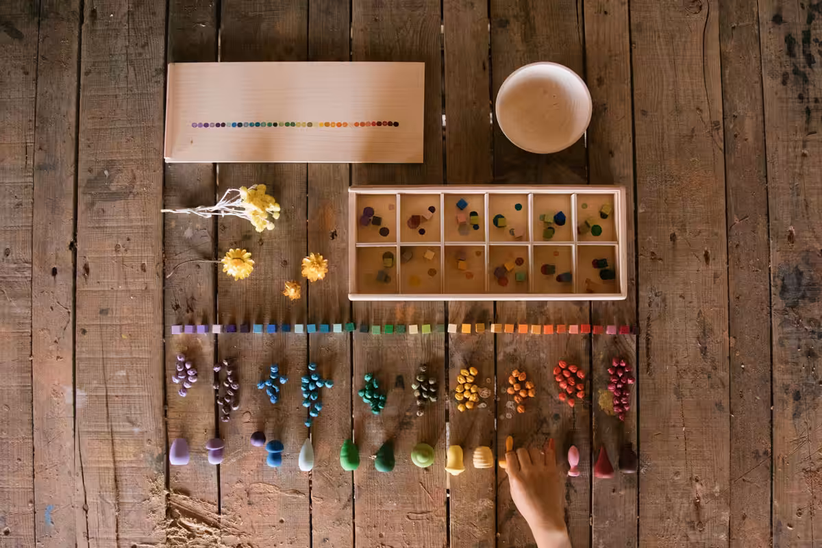 ‘Mis and match’ is a collection of colourful cubes in a wooden sorting box.